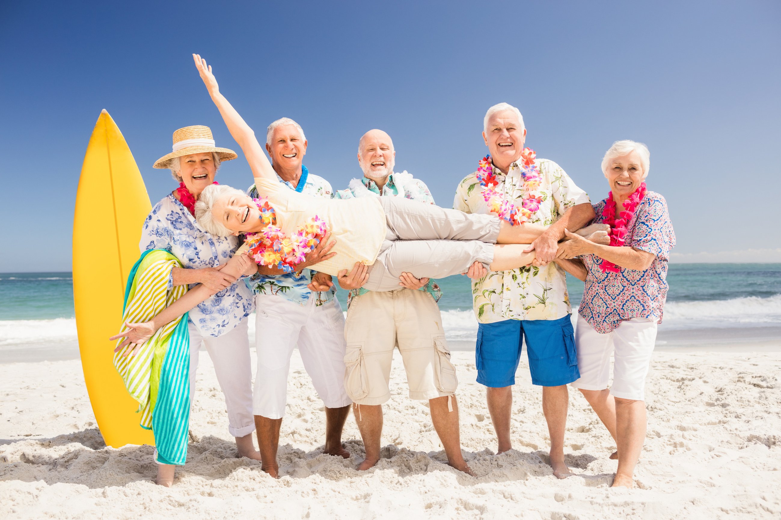 Senior friends holding senior woman